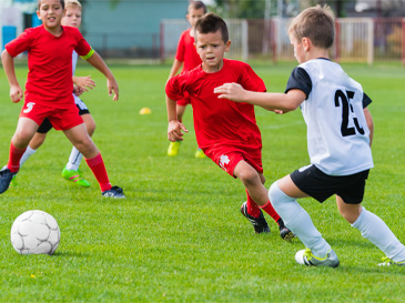 teens playing football